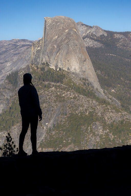 Kristen silhouetted in shadow with Half Dome in the background epic yosemite photography