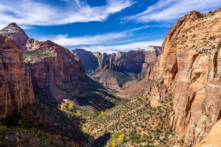 Epic view from Zion Canyon Overlook trail hike in zion national park utah canyon walls towering to either side and in the distance against a blue sky