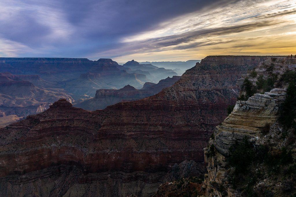 Epic grand canyon sunrise sunset photography guide sun rising at Yavapai Point stunning colors in the sky and canyon lighting up