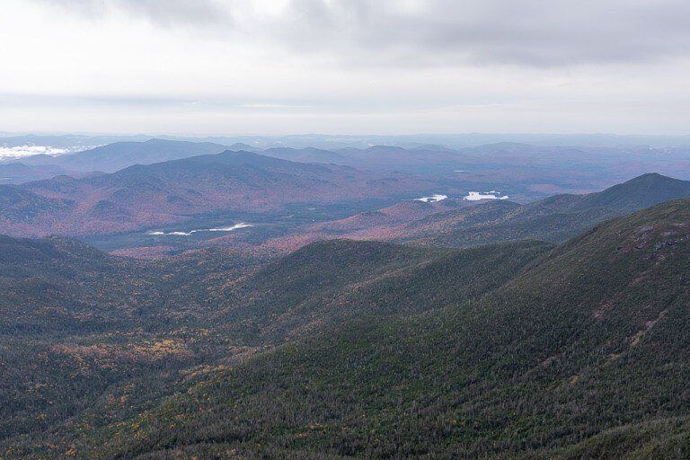 Mount Marcy summit top of the mountain with views over hills as far as the eye can see