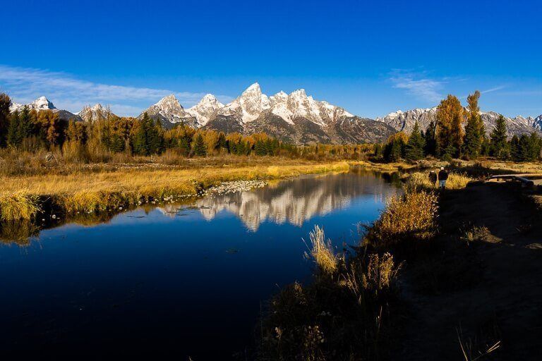 Mountain range reflecting on still water in wyoming