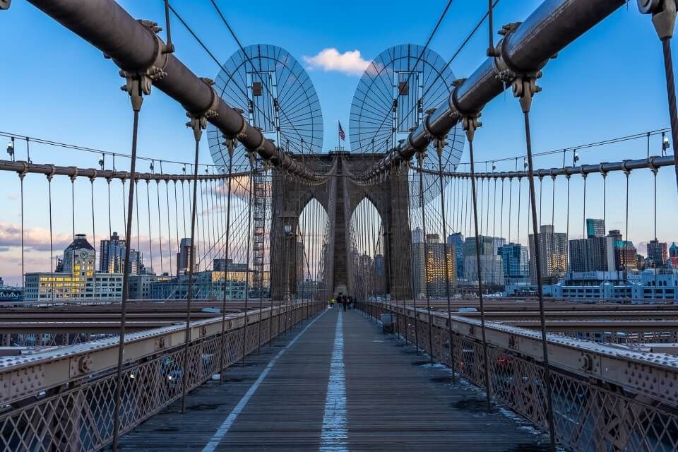 Walking over the Brooklyn Bridge at sunset alone with no tourists in New York City