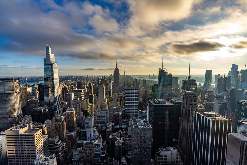 Awesome view over Manhattan at sunset from top of the rock observation deck as part of the new york CityPASS and c3 pass attractions list