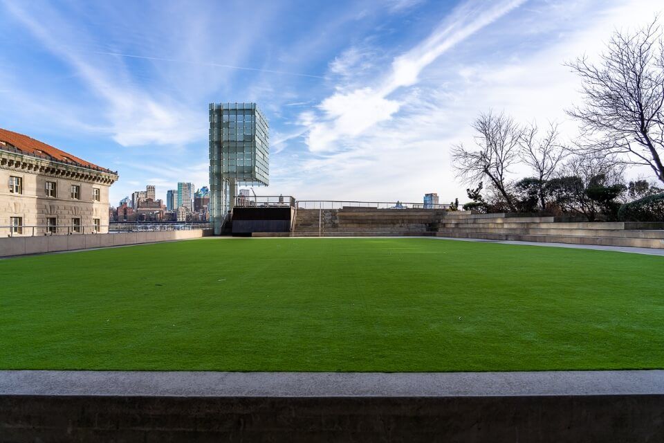Elevated Acre artificial grass on the first level of a building overlooking brooklyn in new york city