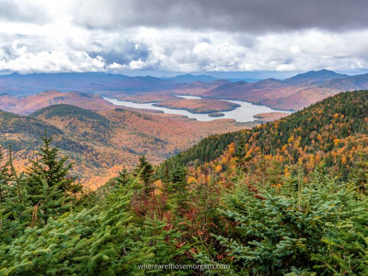 Best things to do in Lake Placid New York Adirondacks including this stunning view over Champlain Lake from Little Whiteface after taking cloud splitter gondola in fall with stunning foliage and clouds Where Are Those Morgans