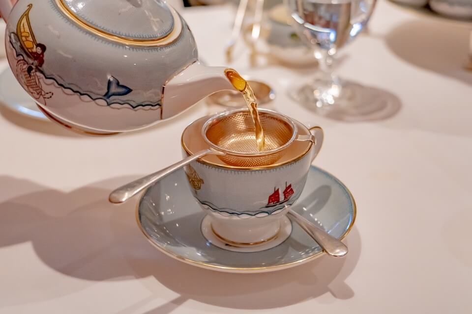 Afternoon tea at the Whitby hotel in manhattan nyc pouring tea from teapot into teacup