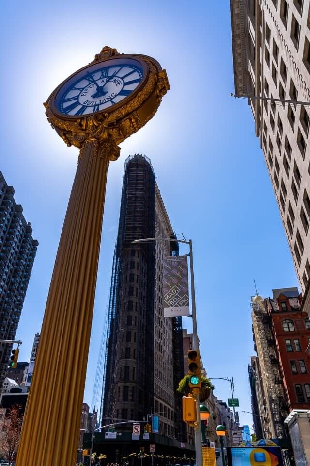 Flatiron building and gold clock are awesome photography spots in NYC get creative when the sun is blazing