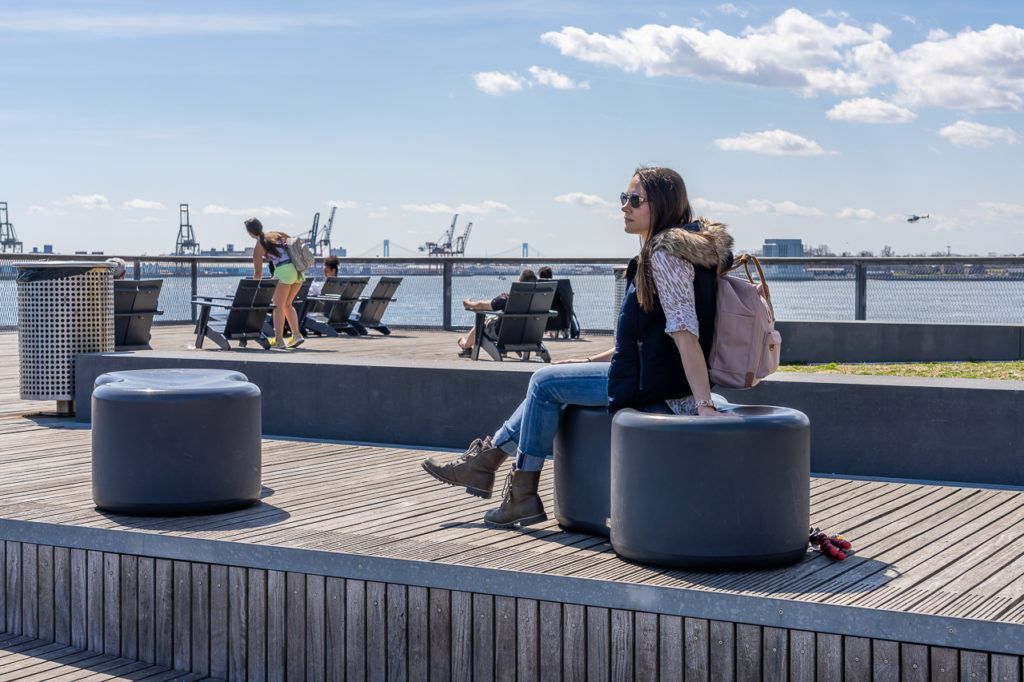 Pier 15 two story decking area open to public offers great views over East river and brooklyn with plenty of places to sit and relax