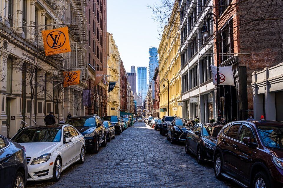 SoHo is a very attractive and photogenic area to photograph around new york city with colorful buildings and cobblestone streets