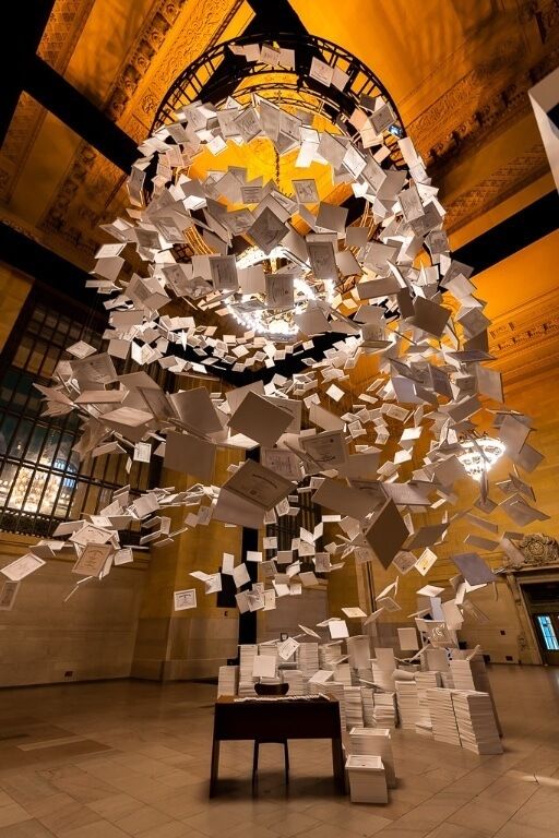 Temporary exhibit in grand central of paper in twisting suspension