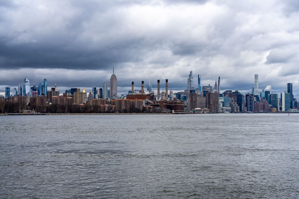 Midtown Manhattan skyline over the East River from Domino Park in Williamsburg NYC awesome photo