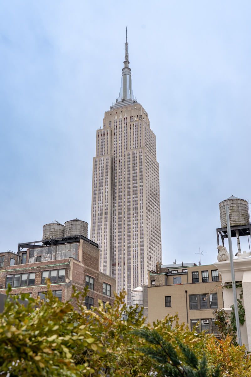 View over Empire State Building from a rooftop bar in manhattan