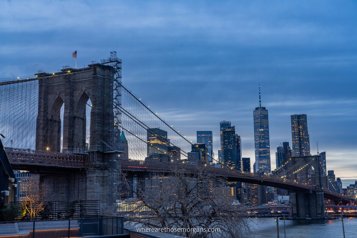 Brooklyn Bridge as seen from Time Out Market at dusk with dark clouds