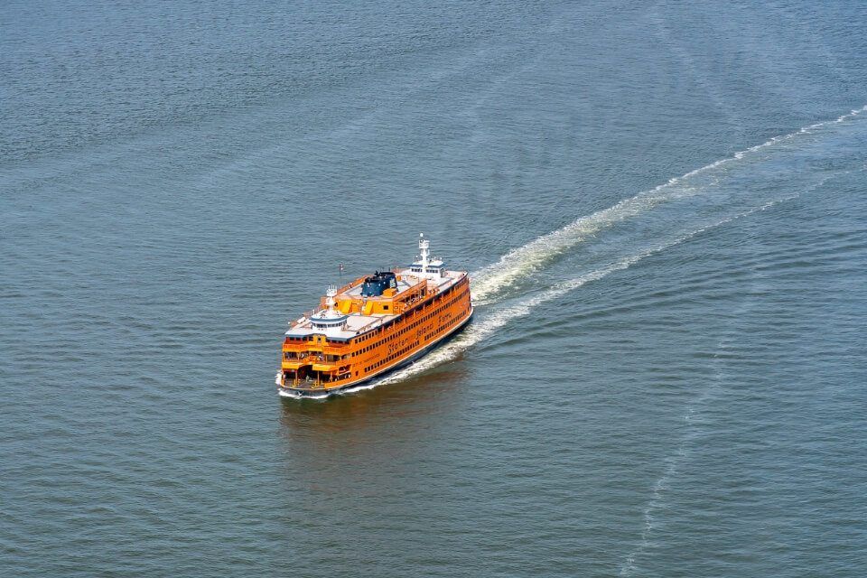 Take a free staten island ferry from manhattan to see statue of liberty orange ship from above
