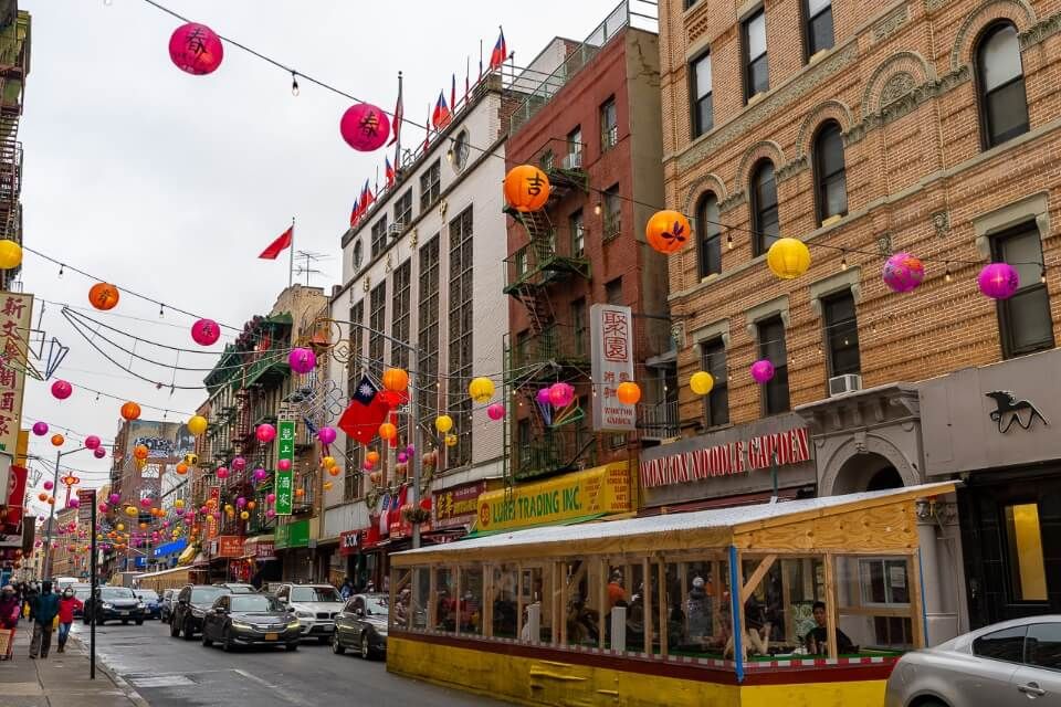NYC chinatown during the day grey sky colorful lanterns