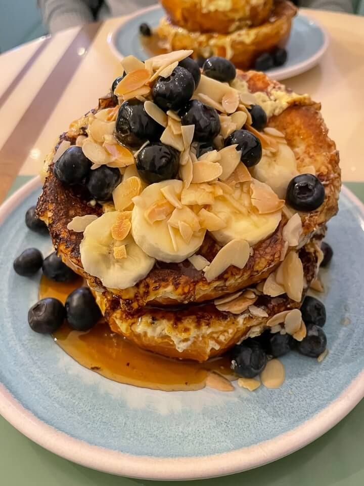 Pancakes banana blueberry maple syrup in french cafe lower manhattan nyc