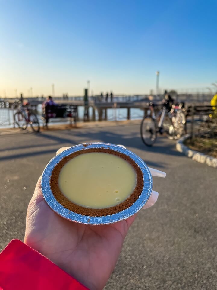 Holding key lime pie in red hook brooklyn looking at statue of liberty