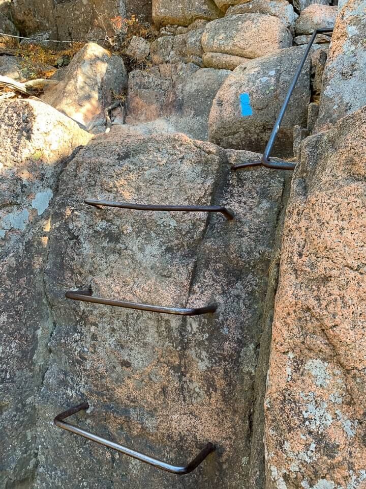 Iron rung ladder built into rock to climb in maine
