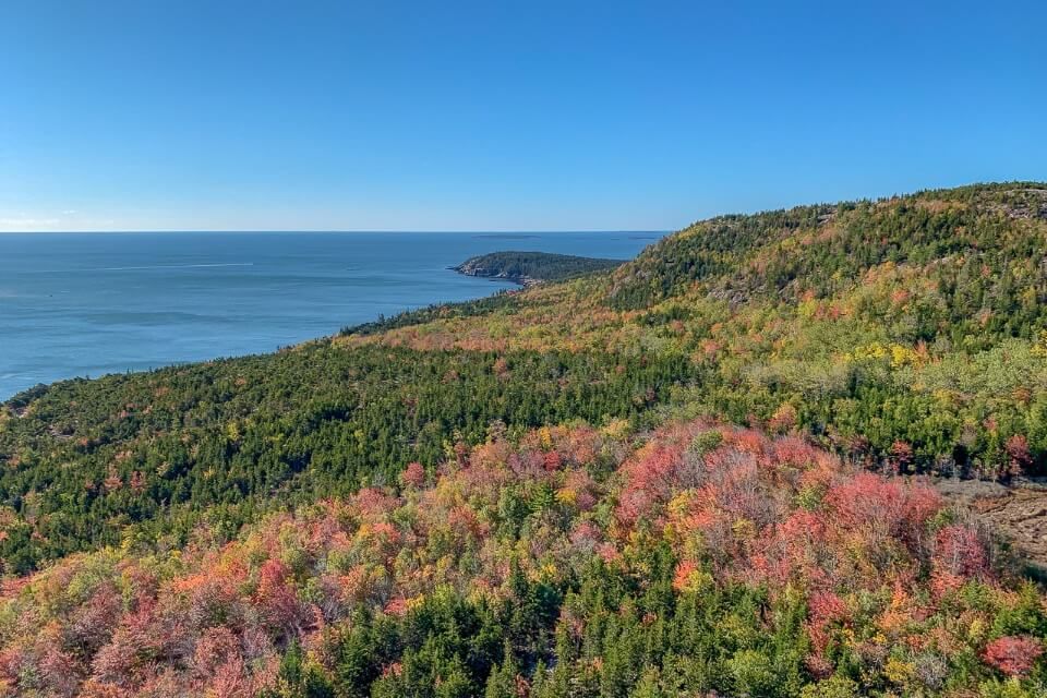 Acadia National Park in Fall with stunning colors from the summit of Beehive Trail hike