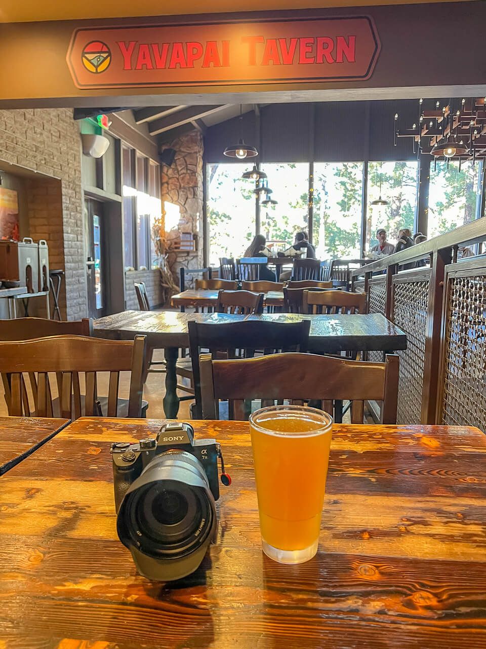 Camera and beer on a table in Yavapai Tavern at Grand Canyon South Rim