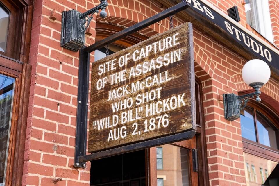A quick visit to deadwood south dakota is a fun family thing to do near mount rushmore see the sign marking where wild bill Hickok was shot