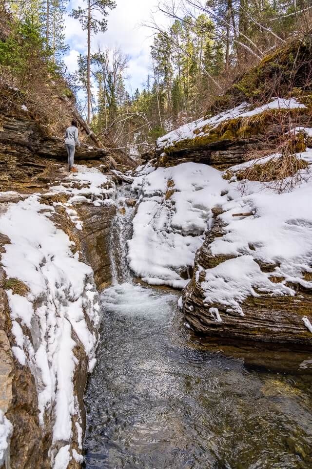 Devils bathtub hiking trail in south dakota spearfish canyon water running with snow around