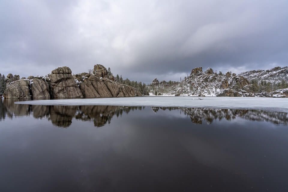 Sylvan Lake in south dakota black hills with reflection and ice sheet one of the best things to do near mount rushmore