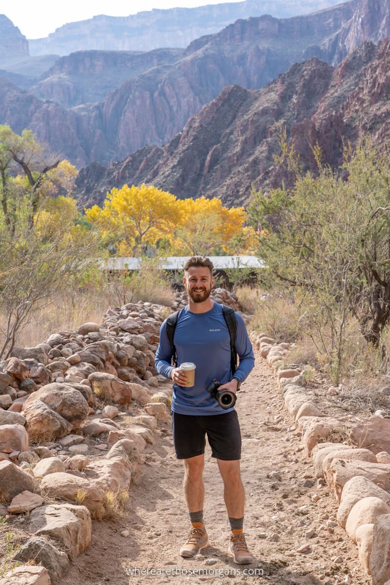 Hiker enjoying a hot chocolate at Phantom Ranch in the bottom of the Grand Canyon
