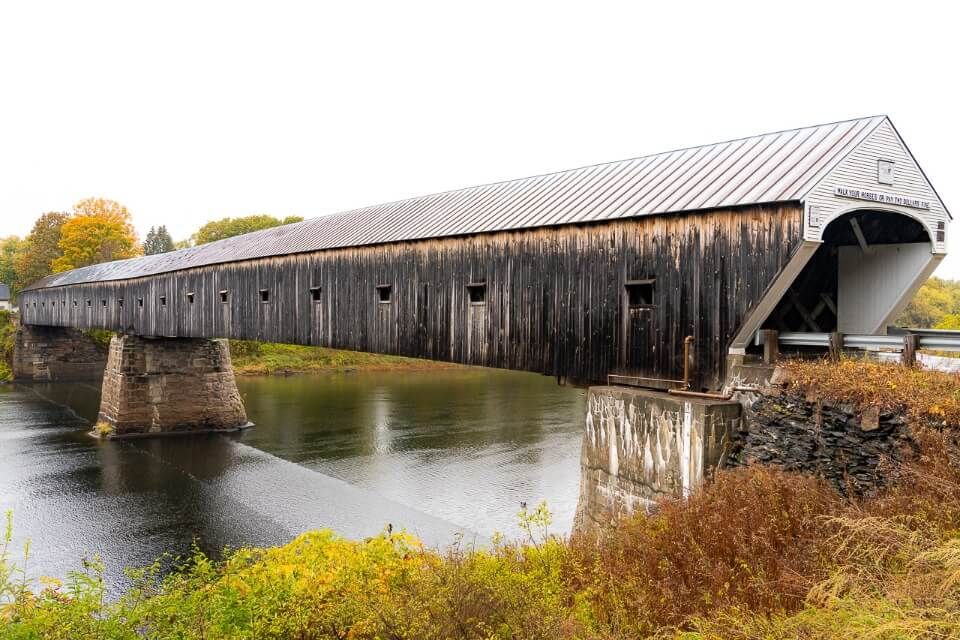 Gorgeous Cornish-Windsor wooden truss two span river crossing in new england