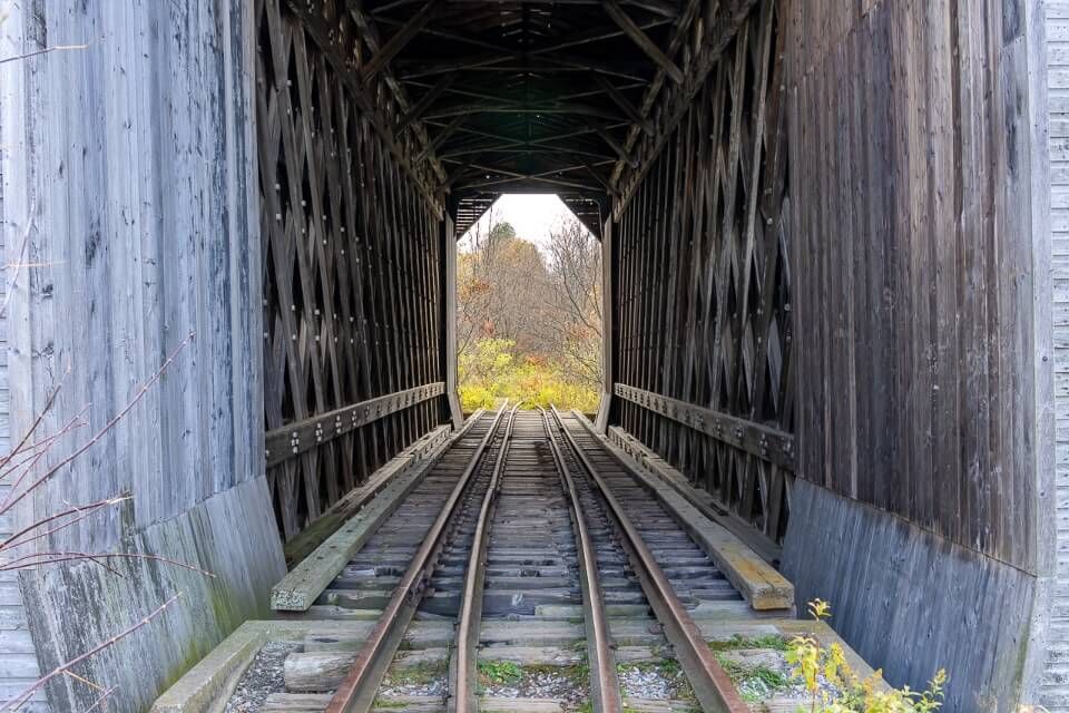 Looking directly through Fisher railroad wooden structure in new england