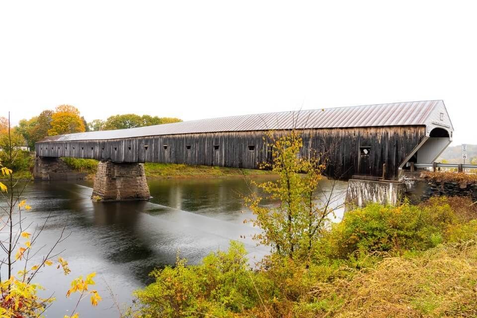 Cornish windsor covered bridge two span wooden bridge in vermont and new hampshire from a side angled profile