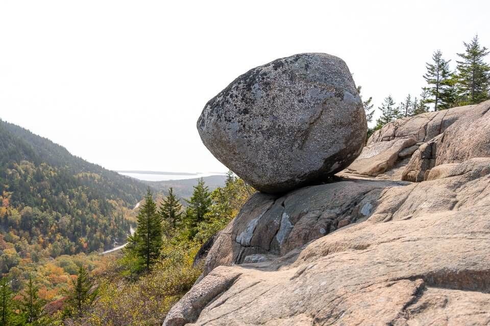 Bubble Rock on South Bubble Trail hike in acadia national park big boulder looking like it will fall off a cliff