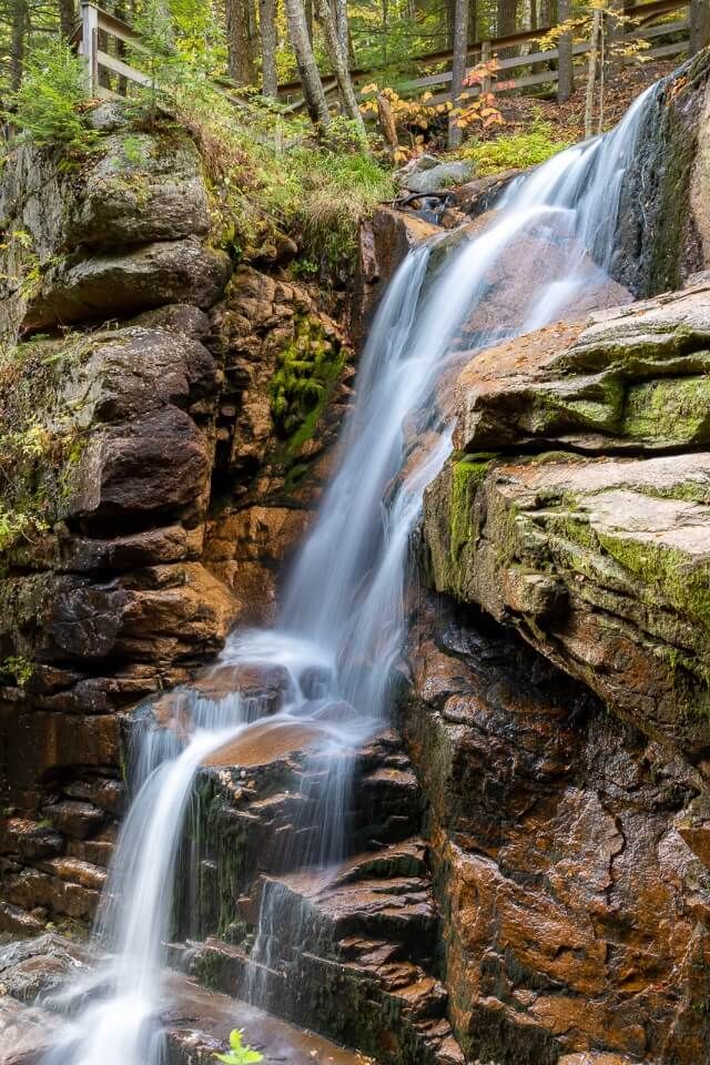 Avalanche Falls flowing lightly in fall Flume Gorge Franconia NH