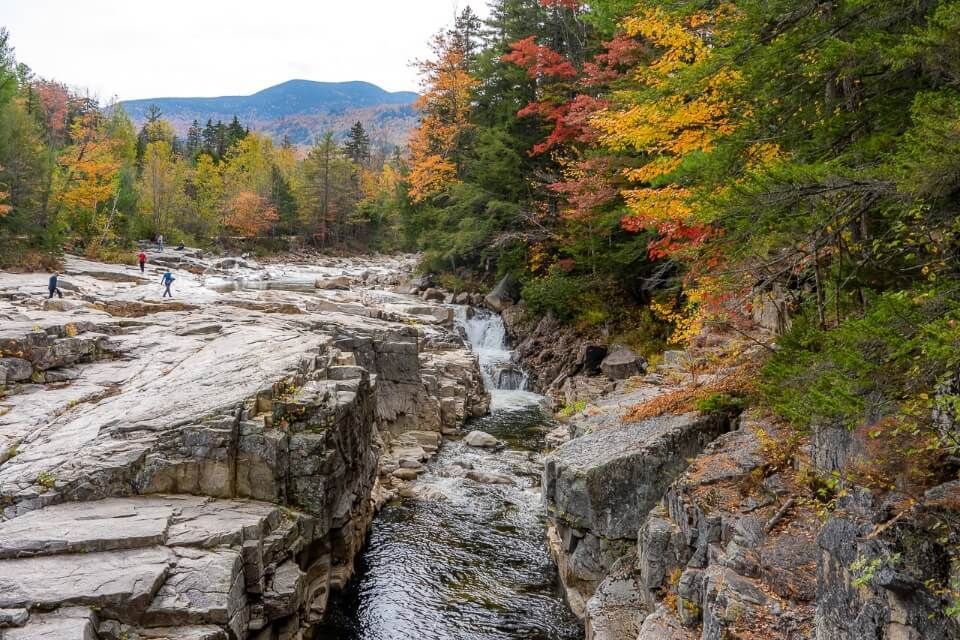 Rocky gorge is one of the best kancamagus highway attractions with narrow rivers and flumes surrounded by fall colors