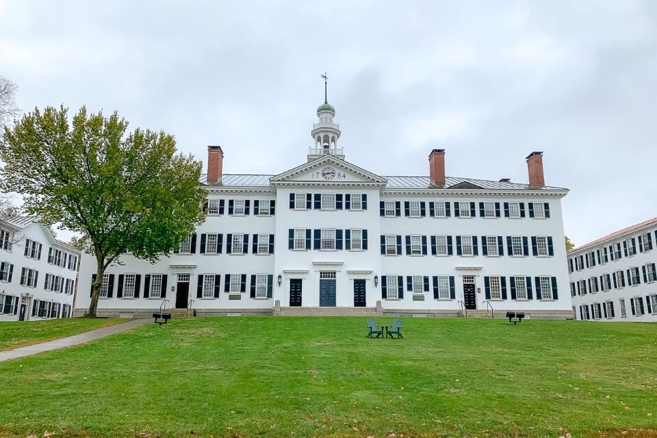 Dartmouth college building white and garden on a cloudy day