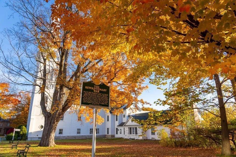 Manchester Historic Village District in Vermont Church with golden yellow leaves