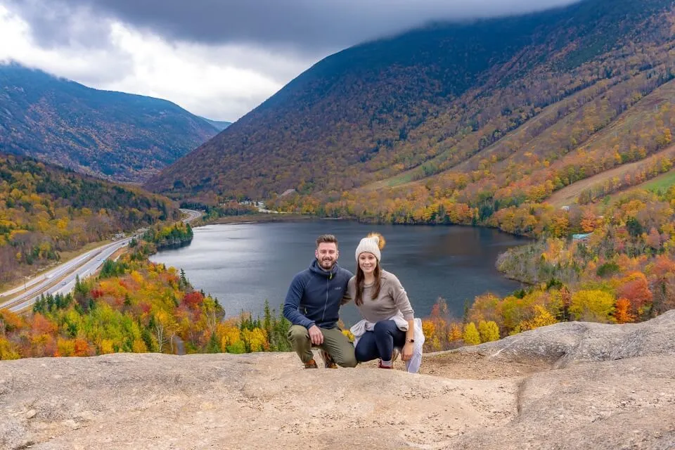 Mark and Kristen Morgan Where Are Those Morgans at Artists Bluff Summit in New Hampshire with Echo Lake background one of the most famous new england fall foliage road trip hikes