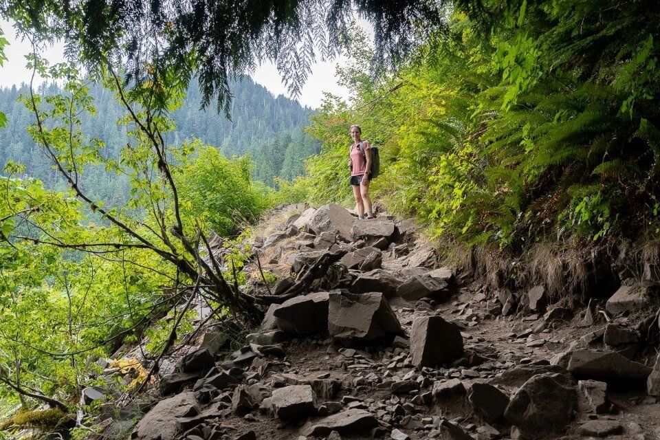 Hiking the Lake 22 trail near granite falls washington rocky trail in shadow from overhanging trees