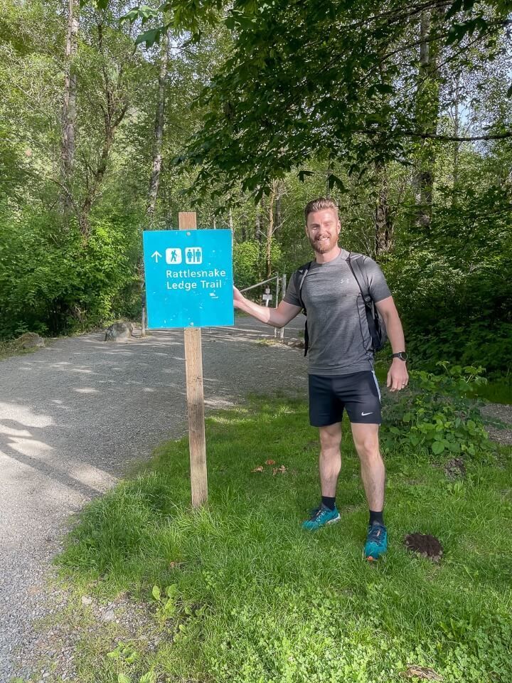 Rattlesnake Ledge Trail Washington Distance Sign Man Pointing Ready To Hike Early Morning