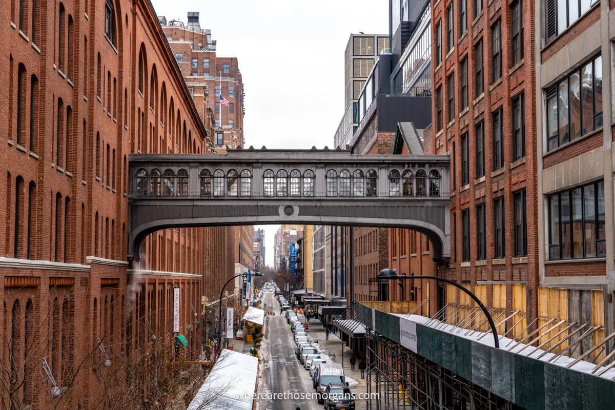 Looking through buildings with a bridge above ground