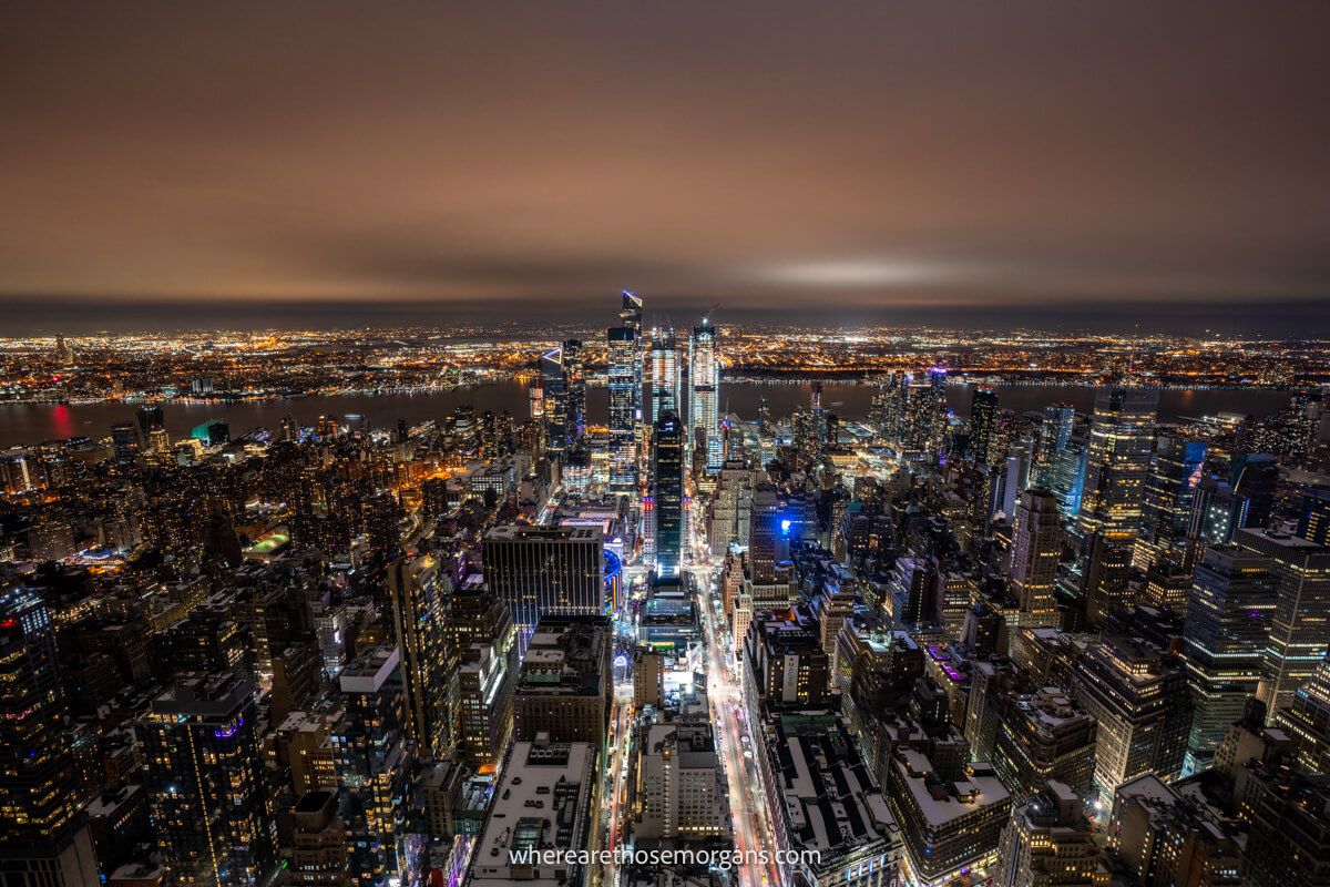 Thick snow clouds above New York City at night reflecting light as seen from the top of an observation deck