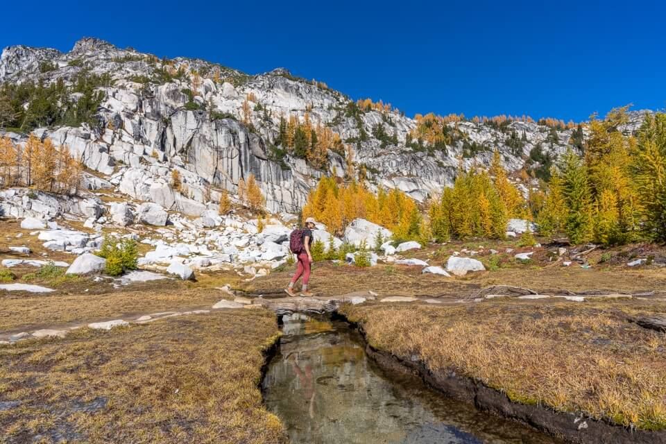 Crossing a bridge on a trail in cascades