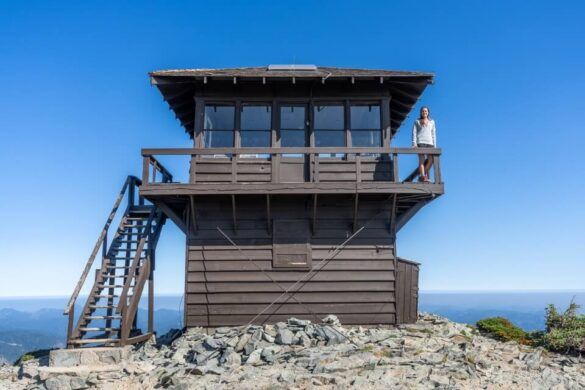 Day hiking the Mount Fremont Lookout Trail to one of four remaining fire watch towers in Mt Rainier national park on a beautiful sunny day blue sky two tiered wooden structure awesome hike