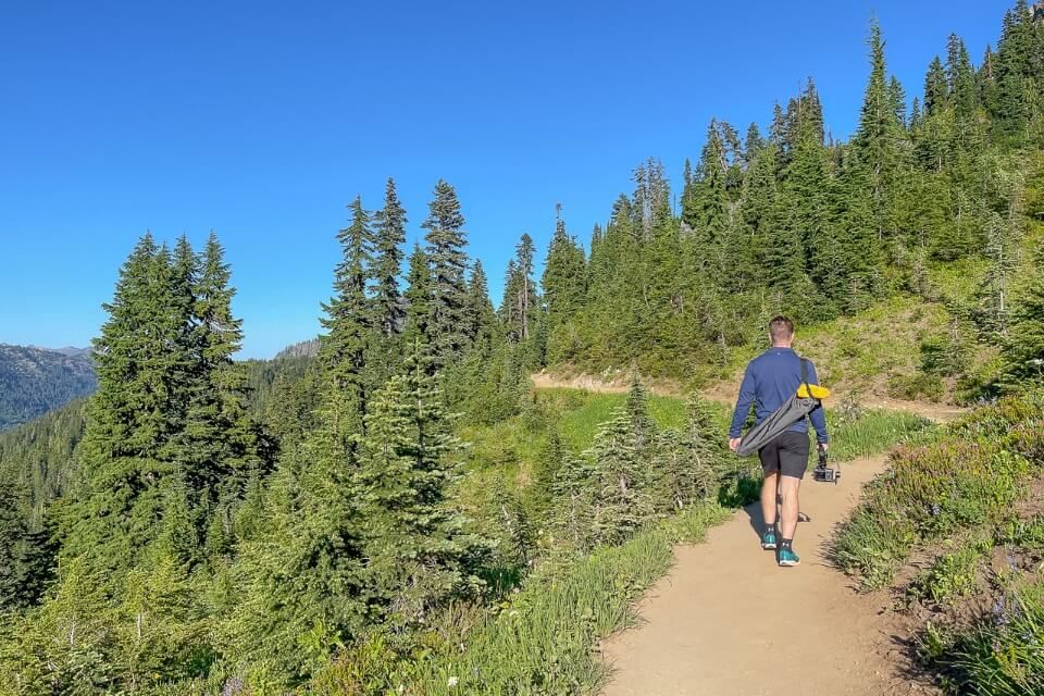 Hiking a dusty path in mt rainier national park washington on a sunny day