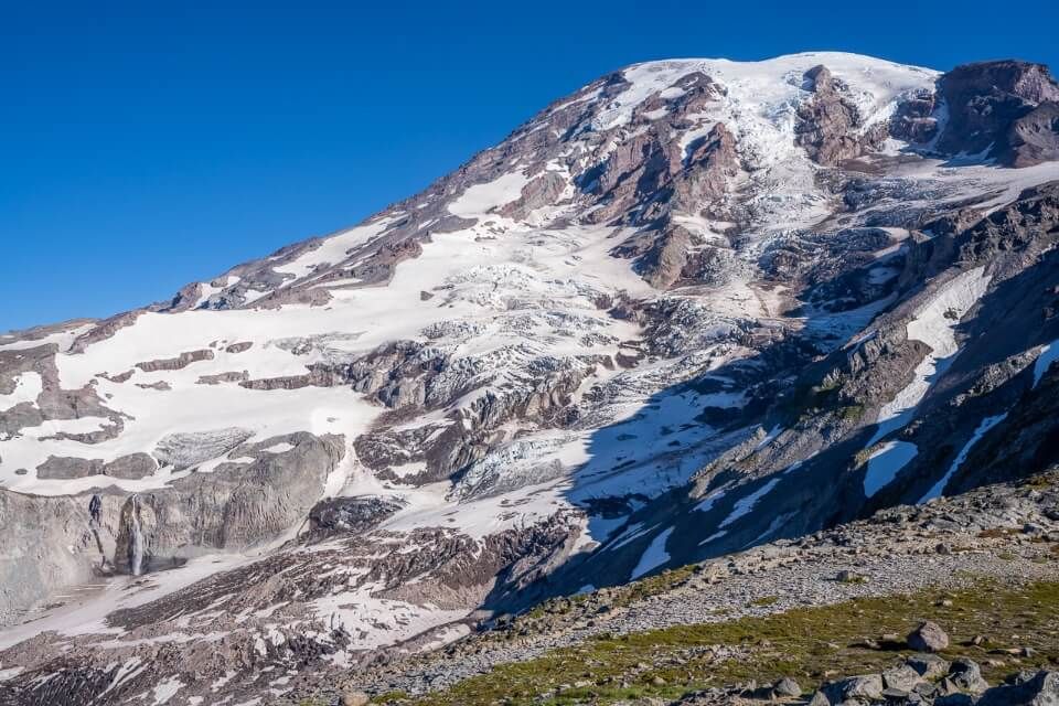 Camp Muir is a very hard long hike high up Mt Rainier only for experienced hikers glaciers and waterfall with some of the mountain in shadow
