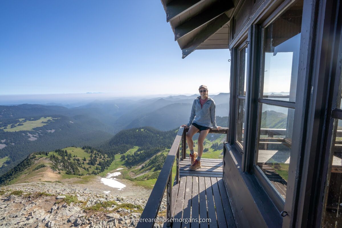 Hiker at the top of Mt Fremont Lookout Tower enjoying spectacular distant views to the horizon