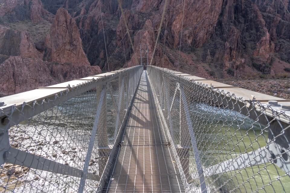 Bright Angel Bridge crossing the Colorado River in grand canyon national park day hike
