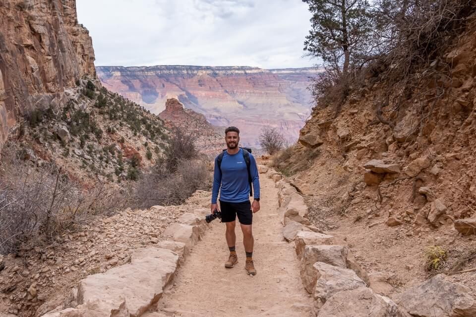 Climbing out of the grand canyon via bright angel trail with a camera in late afternoon