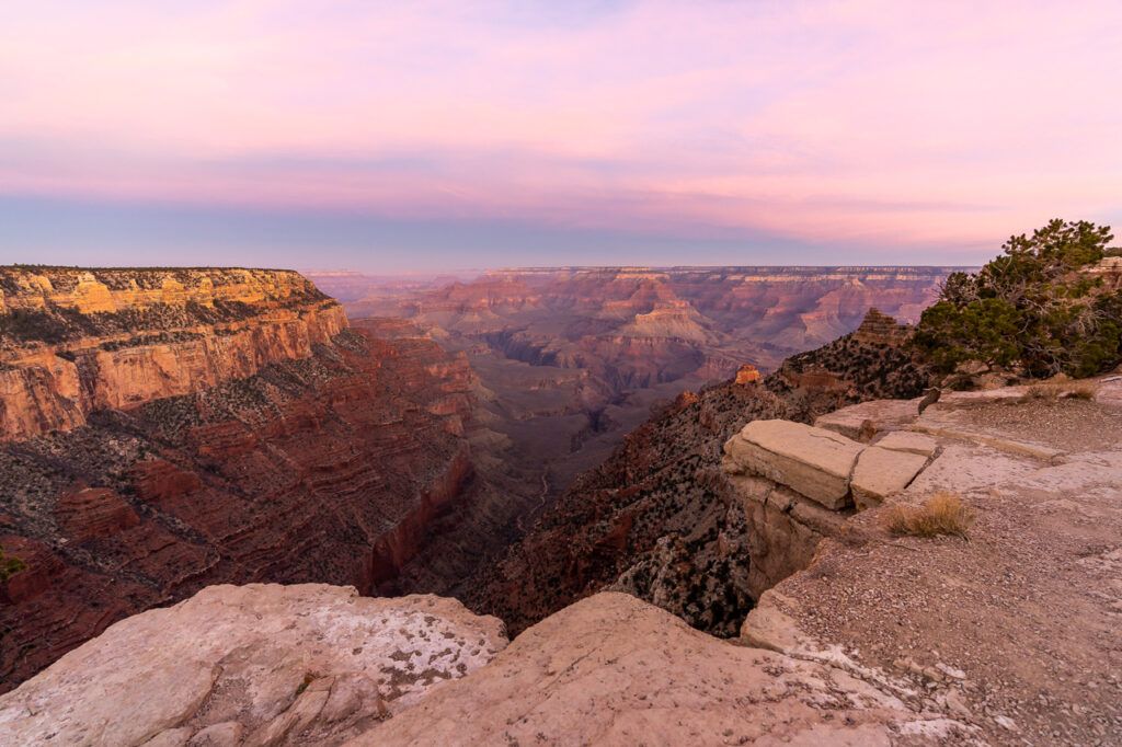 Beautiful pink sky december in the grand canyon walking down south kaibab trail in winter