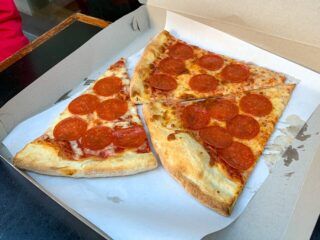 Best pizza in NYC three slices of pepperoni pizza